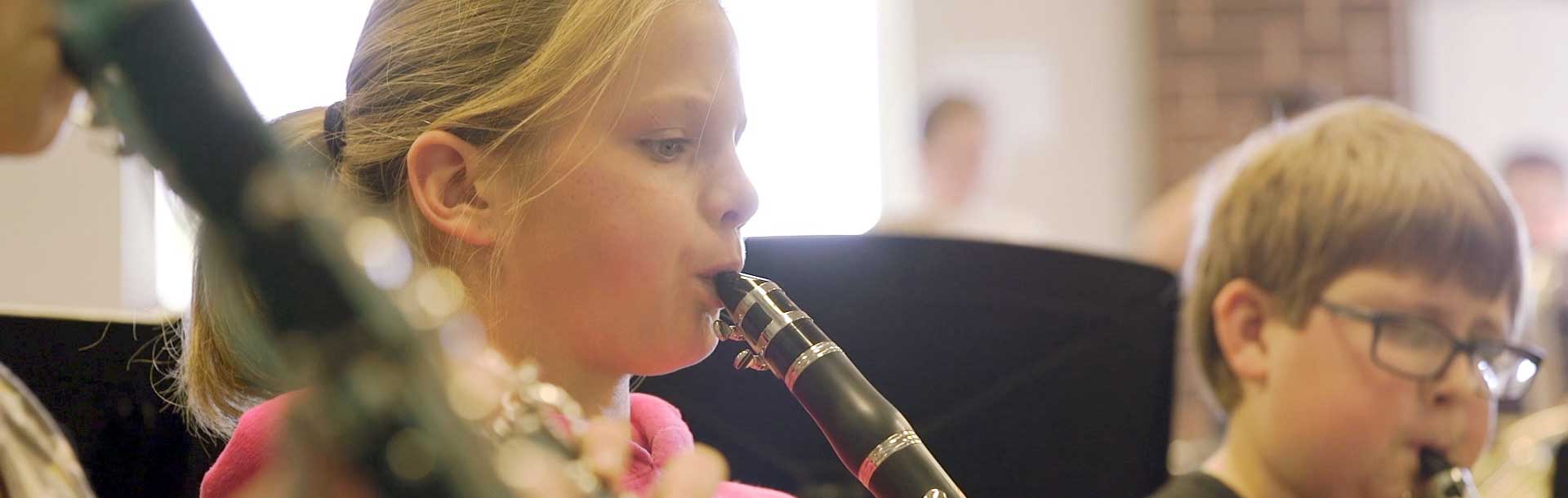 Student Playing Clarinet in Band Class